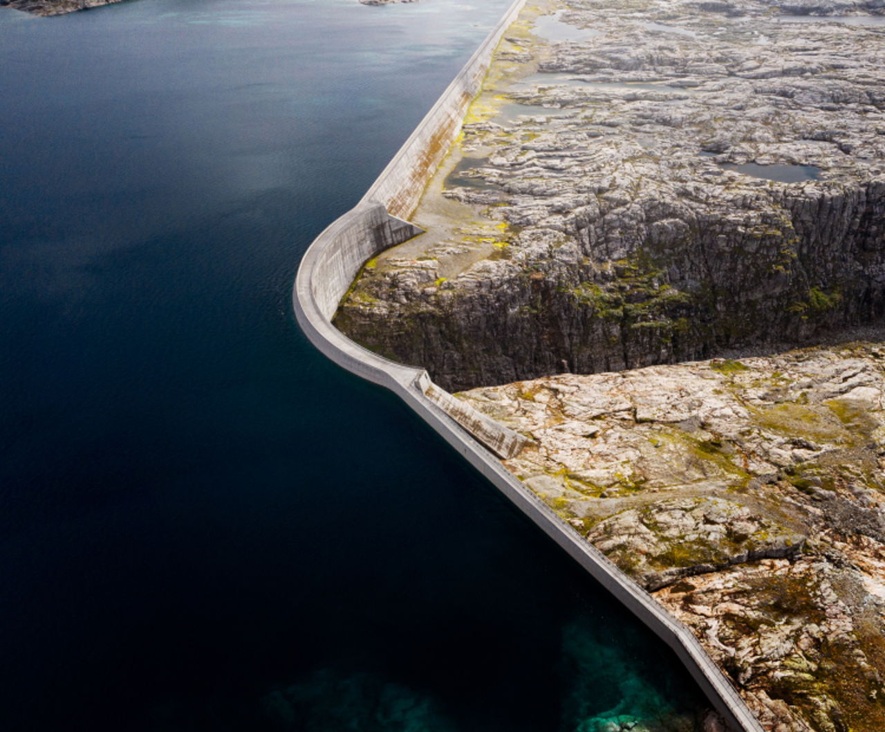 Dam of blue water showing power plant and renewable energy certificate